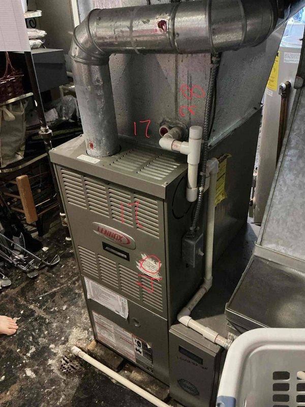 Conducted comprehensive estimate for furnace and air conditioning system replacement. Evaluated existing Lennox furnace installation, assessed ductwork configuration and condition, documented current system specifications, and photographed equipment layout including condensate drainage and venting components to provide accurate replacement recommendations.
