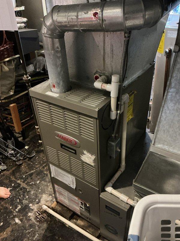 Conducted comprehensive estimate for furnace and air conditioning system replacement. Evaluated existing Lennox furnace installation, assessed ductwork configuration and condition, documented current system specifications, and photographed equipment layout including condensate drainage and venting components to provide accurate replacement recommendations.