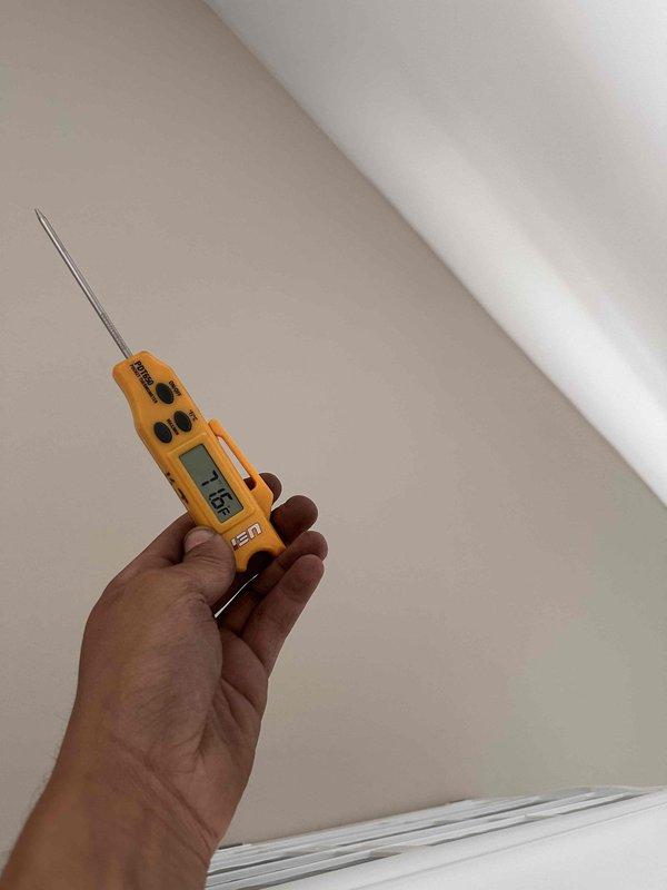 Completed mini split installation for upstairs bedroom. System was properly evacuated using digital vacuum gauge to ensure proper refrigerant charge, and electrical connections were verified with voltage testing equipment showing 115V supply. Unit commissioned and confirmed operational.