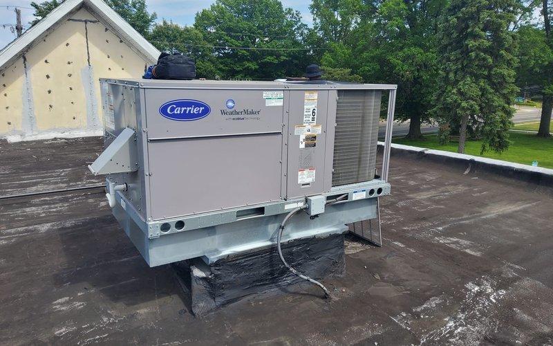 Responded to no-cooling call on rooftop Carrier WeatherMaker unit. Upon arrival, inspected electrical disconnect box and found blown fuses in the contactor assembly, which caused the unit to stop cooling earlier in the day. Replaced damaged fuses, verified proper electrical connections, and restored unit to normal operation with cooling confirmed.