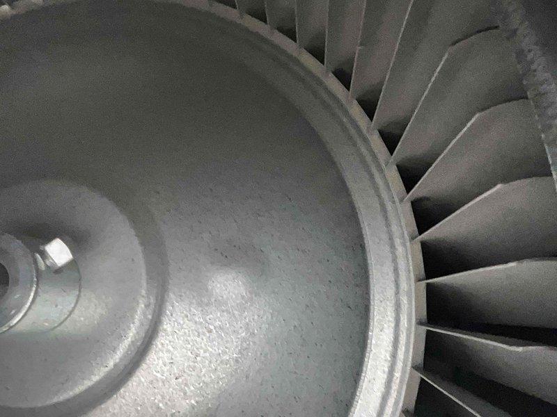 Performed annual maintenance on a 1-year-old air conditioning system. Inspected blower wheel assembly for cleanliness and proper operation, verified all components were secure and functioning correctly. Connected refrigerant manifold gauges to measure system pressures and temperatures, confirmed operating pressures within manufacturer specifications at 405.1 PSIG high side and 138 PSIG low side with corresponding temperatures of 156°F and 54°F respectively. System operating efficiently with no issues found.