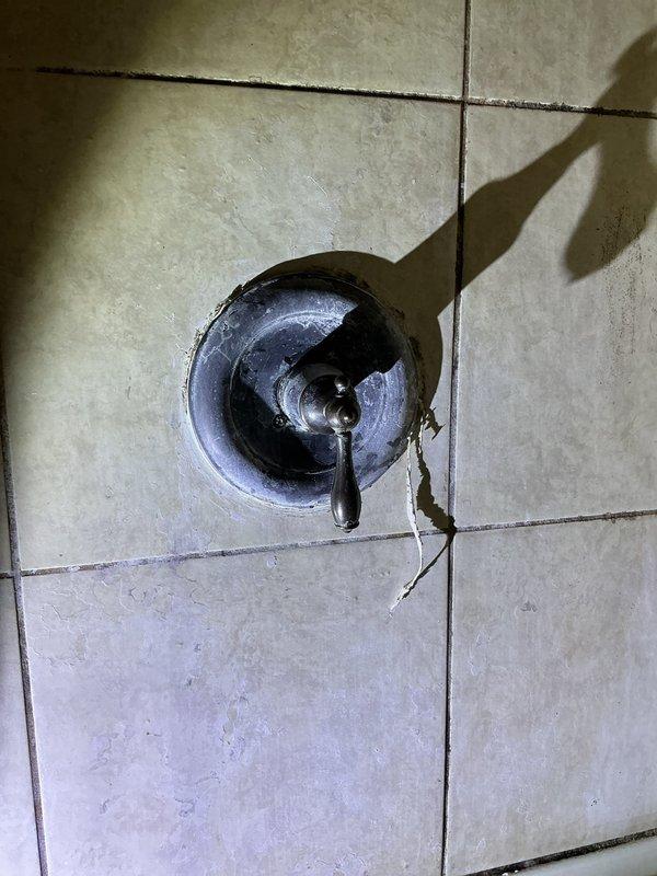 Responded to emergency service call for shower faucet that could not be shut off. Upon arrival, assessed the shower valve assembly and successfully repaired the malfunctioning shutoff mechanism, restoring proper water control to the fixture. Documented existing tile damage near the faucet installation and floor drain condition for customer records.