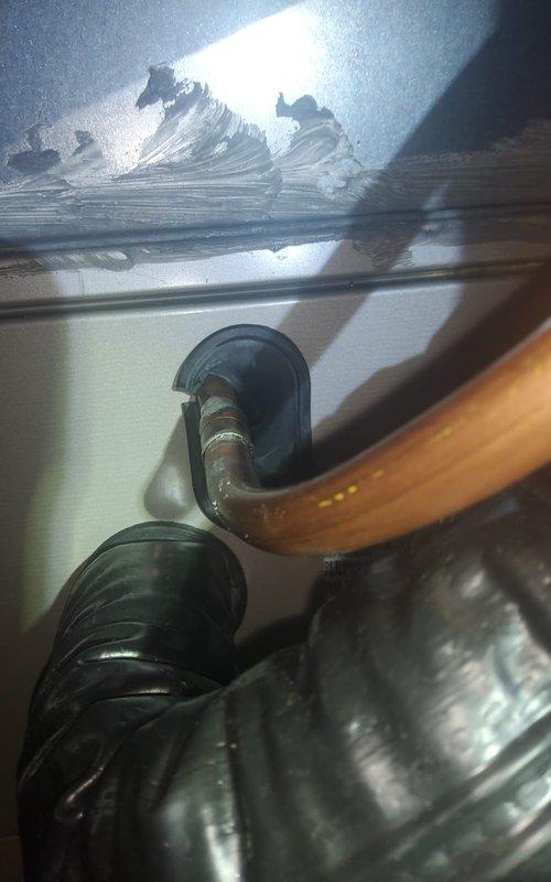 Responded to callback for 8-month-old air conditioning system experiencing repeat refrigerant leak issues from previous service in April. Upon arrival, found extensive ice buildup on evaporator coil and refrigerant lines, indicating significant refrigerant loss from leaking fittings on the outdoor unit. Documented frost accumulation with photos showing crystalline ice formations on coil surfaces and copper refrigerant piping. System had been minimally used since initial installation, operating only from April through June before failure recurred. Verified thermostat operation and confirmed unit set to 69 degrees. Identified improper fitting connections as root cause of recurring refrigerant leaks, consistent with previous service history. Recommended evaluation of installation quality and potential equipment replacement due to pattern of premature failure and compromised system integrity.
