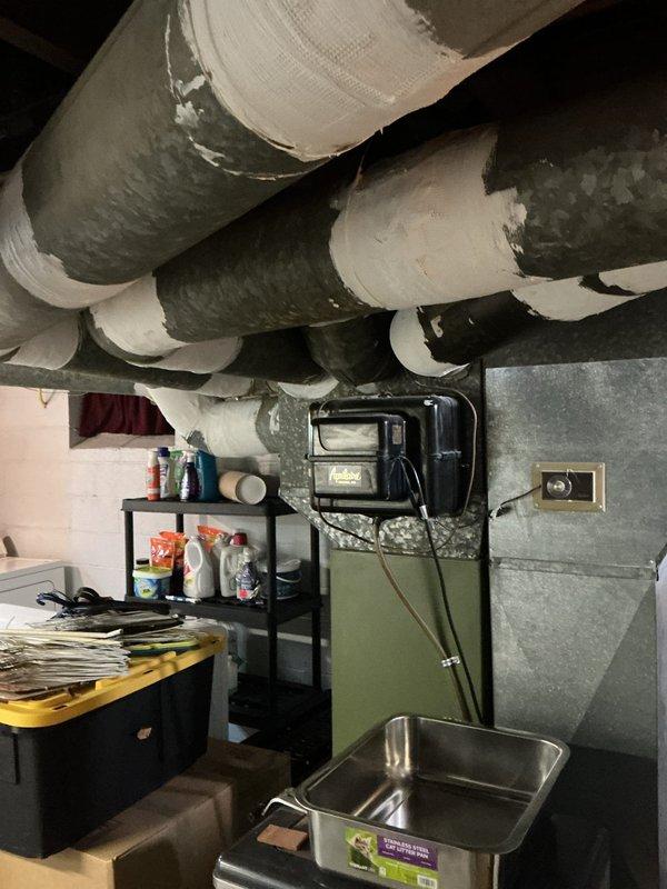 Completed comprehensive HVAC estimate for furnace and air conditioning system replacement with additional ductwork installation required to service home addition and room above garage. Assessed existing basement mechanical infrastructure including current ductwork configuration, electrical panels, and available space for new equipment placement. Documented existing insulated duct runs and determined routing requirements for extended ductwork to adequately condition previously unconditioned spaces in the addition and above-garage room.