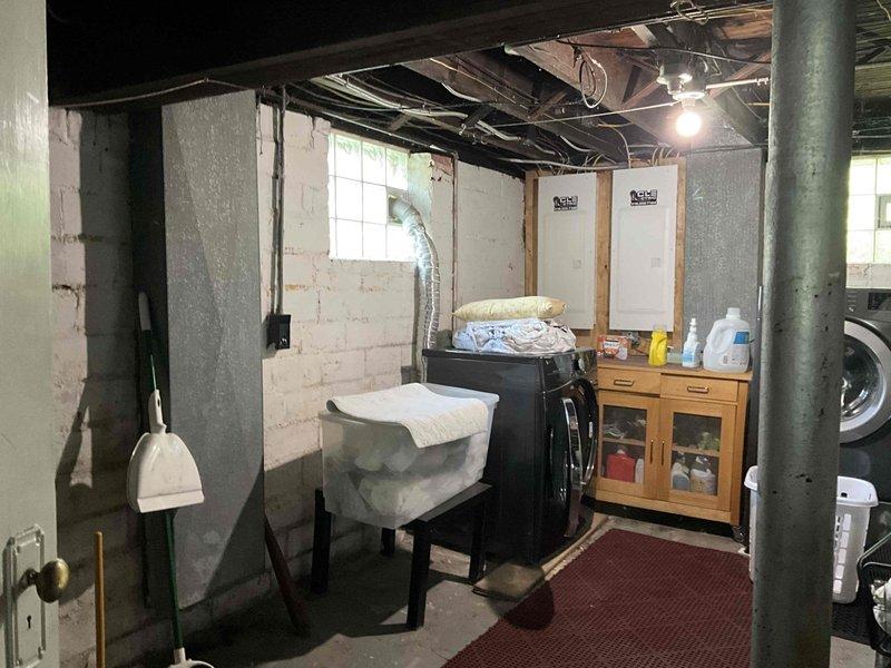 Conducted on-site evaluation for complete HVAC system replacement in residential basement location. Assessed existing electrical panel capacity and circuit availability to determine compatibility with new equipment requirements, documented current utility area configuration including available clearances and access points for equipment installation, and photographed mechanical space layout to facilitate accurate equipment sizing and placement planning for the replacement estimate.