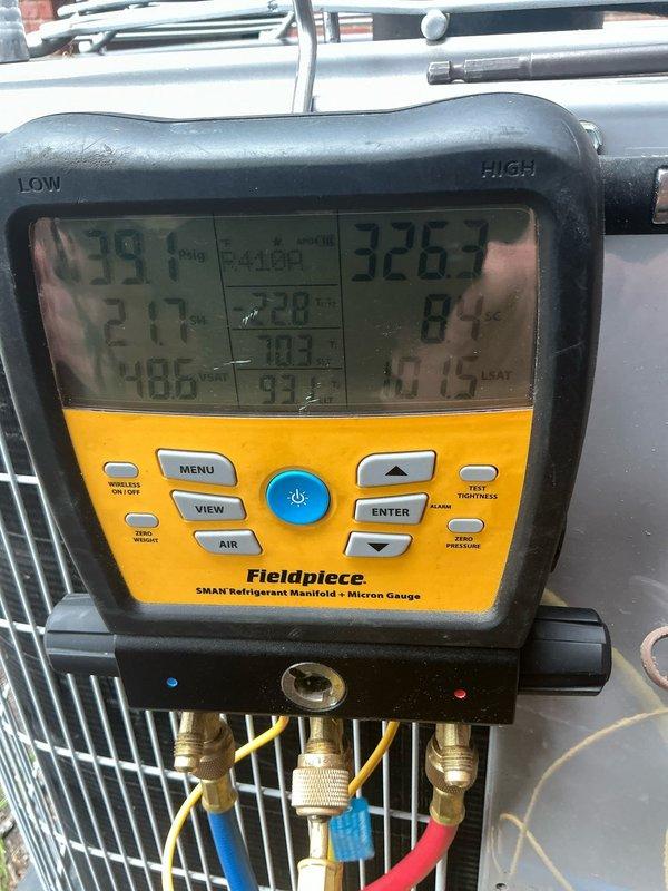Responded to no cooling complaint with reported loud unusual noise during operation. Upon arrival, performed comprehensive diagnostic testing of air conditioning system that had recently received tune-up service. Utilized refrigerant manifold and micron gauge to measure system pressures, recording suction pressure of 39 PSI and discharge pressure of 326 PSI. Employed clamp meter to test electrical components, measuring current draw of 0.724 amps at compressor circuit. Inspected capacitor connections and verified proper voltage to outdoor unit. Testing revealed abnormal operating parameters contributing to inadequate cooling performance and noise issue. Identified failed compressor based on low amp draw, improper pressure readings, and audible mechanical failure symptoms. Advised system requires compressor replacement to restore proper cooling operation.
