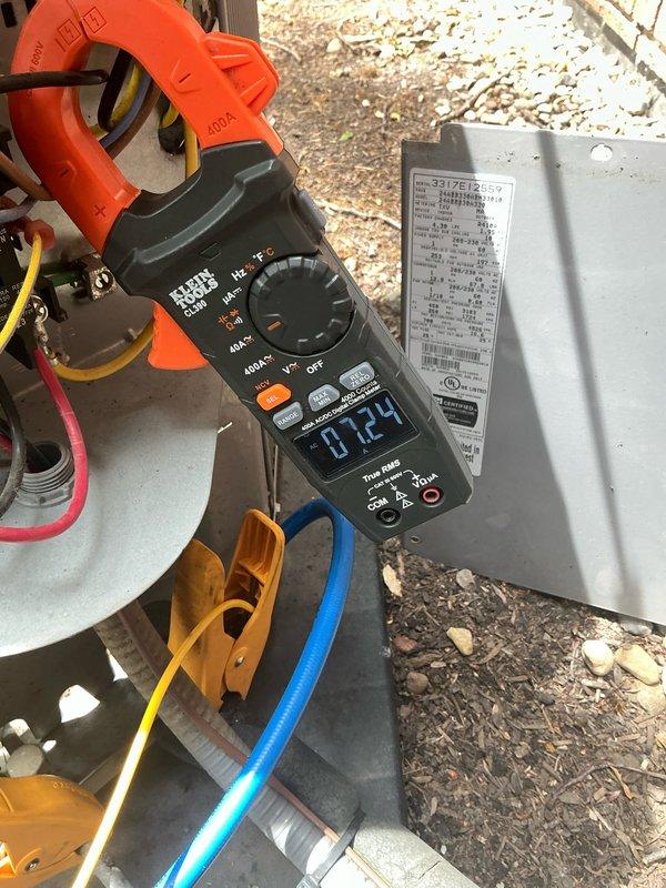 Responded to no cooling complaint with reported loud unusual noise during operation. Upon arrival, performed comprehensive diagnostic testing of air conditioning system that had recently received tune-up service. Utilized refrigerant manifold and micron gauge to measure system pressures, recording suction pressure of 39 PSI and discharge pressure of 326 PSI. Employed clamp meter to test electrical components, measuring current draw of 0.724 amps at compressor circuit. Inspected capacitor connections and verified proper voltage to outdoor unit. Testing revealed abnormal operating parameters contributing to inadequate cooling performance and noise issue. Identified failed compressor based on low amp draw, improper pressure readings, and audible mechanical failure symptoms. Advised system requires compressor replacement to restore proper cooling operation.
