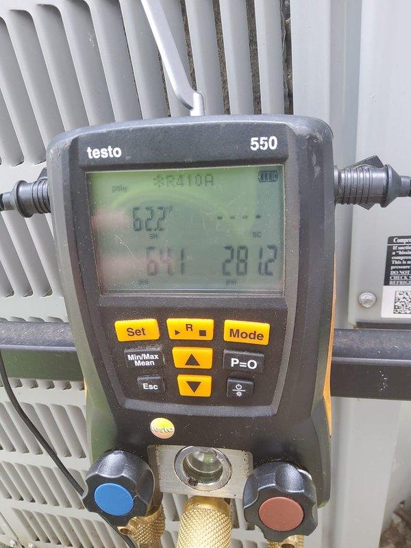 Responded to no cooling complaint on 5-year-old air conditioning system with water pooling below condenser. Upon arrival, connected digital manifold gauges to measure system pressures and temperatures. Diagnostic readings revealed system was operating at 100.5 psi with 156°F temperature, indicating low refrigerant charge. Confirmed system had no refrigerant available, which was causing inadequate cooling and improper coil operation leading to condensate drainage issues. Documented system parameters and equipment conditions with diagnostic gauge readings for service records.