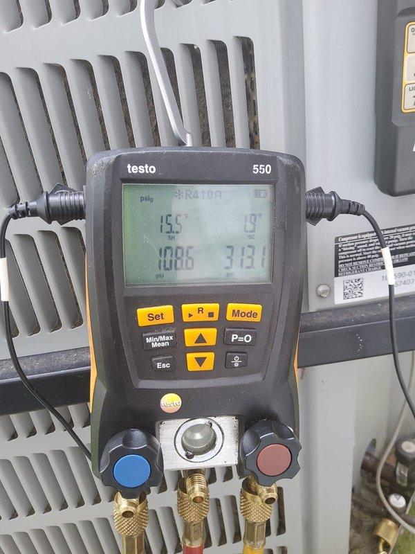 Responded to no cooling complaint on 5-year-old air conditioning system with water pooling below condenser. Upon arrival, connected digital manifold gauges to measure system pressures and temperatures. Diagnostic readings revealed system was operating at 100.5 psi with 156°F temperature, indicating low refrigerant charge. Confirmed system had no refrigerant available, which was causing inadequate cooling and improper coil operation leading to condensate drainage issues. Documented system parameters and equipment conditions with diagnostic gauge readings for service records.