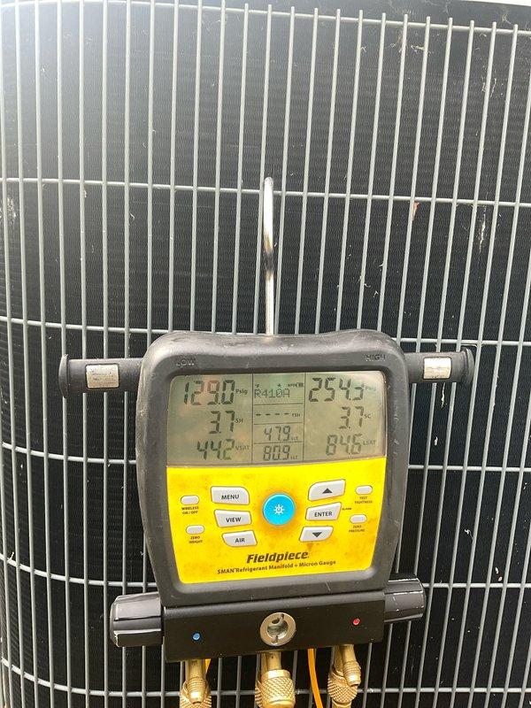 Completed comprehensive cooling season maintenance on two residential air conditioning systems rated 8-12 HP. Performed standard tune-up procedures including refrigerant pressure and temperature diagnostics using digital manifold gauges, verified proper system operation and superheat/subcooling values, inspected condensate drain lines for proper flow and clearing, and cleaned condenser coil fins. Both units tested within normal operating parameters and are ready for the cooling season.