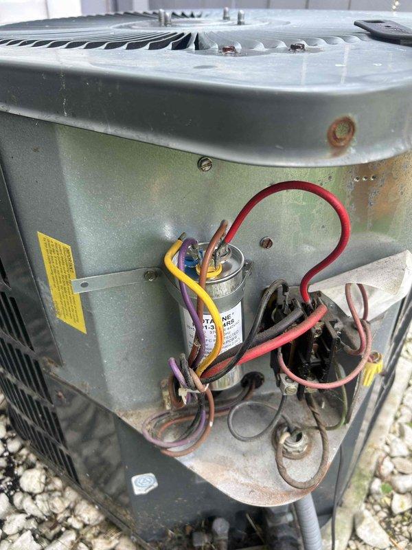 Responded to no cooling complaint with frozen evaporator coil. Upon inspection, diagnosed failed run capacitor causing compressor to hum without starting, resulting in system freeze-up. Verified diagnosis with electrical testing showing capacitor reading 5.0 microfarads, well below manufacturer specifications. Replaced defective capacitor, allowed system to thaw, and confirmed proper compressor amperage and normal operation upon restart.