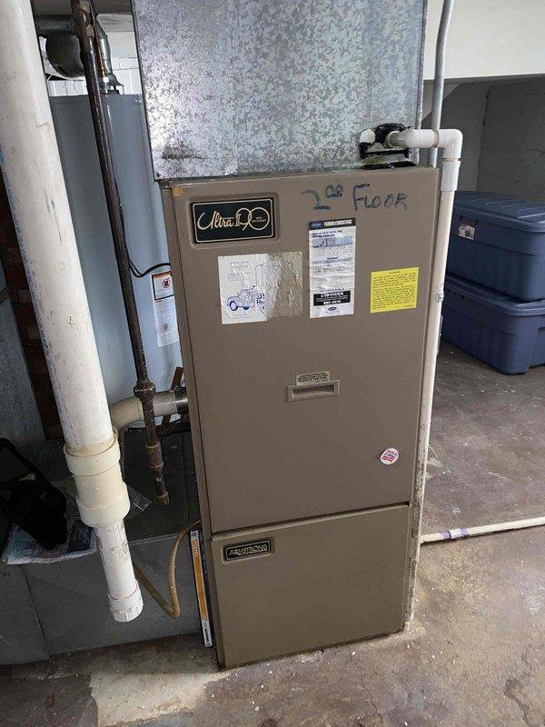 # HVAC Service Call - No Cooling Condition

Responded to a no cooling complaint affecting the entire second floor unit. Upon arrival, accessed the air handler cabinet to inspect internal components and verify system operation. Performed visual inspection of the blower motor assembly, control boards, and electrical connections. Checked refrigerant pressures using manifold gauges to assess system charge levels and identify potential issues with the cooling cycle.

Examined all visible electrical components including transformers, relays, and wiring connections for proper operation and signs of failure. Inspected copper refrigerant lines at the air handler for leaks, damage, or restrictions. Verified proper condensate drainage through PVC piping system. Evaluated overall system condition and documented findings with photographic evidence of internal components and equipment identification showing second floor designation marked on the Clima 50 unit.

System assessed and appropriate correc