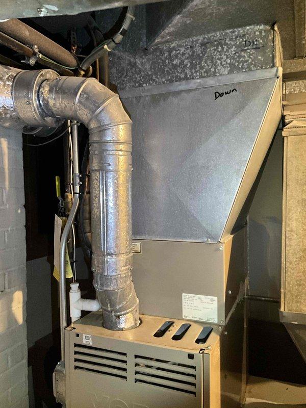 Completed revised estimate for HVAC system replacement in basement utility area. Documented existing furnace/air handler unit with connected ductwork and assessed aging mechanical infrastructure including deteriorating pipes and ventilation components. Provided additional equipment options and configurations based on customer request for expanded replacement alternatives.