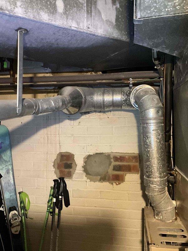 Completed revised estimate for HVAC system replacement in basement utility area. Documented existing furnace/air handler unit with connected ductwork and assessed aging mechanical infrastructure including deteriorating pipes and ventilation components. Provided additional equipment options and configurations based on customer request for expanded replacement alternatives.