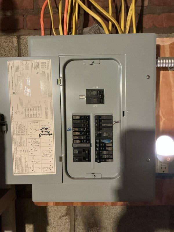 Conducted on-site evaluation for mini split system installation in residential living space. Assessed electrical panel capacity and available circuits to support new equipment, documented proposed indoor unit mounting location on living room wall, and confirmed adequate electrical infrastructure for system installation.
