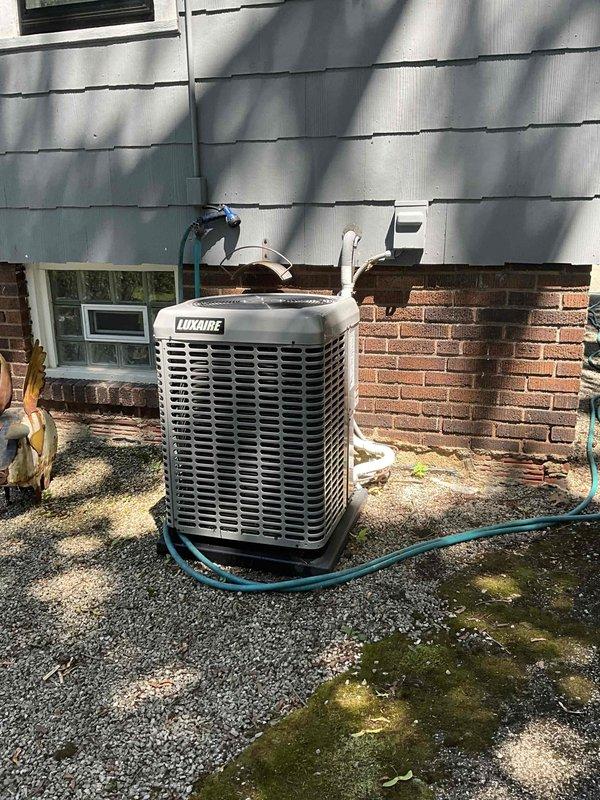 Responded to no cooling complaint on residential split system. Upon arrival, evaluated existing Luxaire outdoor condensing unit and indoor air handler for system failure. Conducted comprehensive assessment of equipment condition, refrigerant lines, electrical connections, and overall system performance. Documented current installation including outdoor unit on gravel pad with refrigerant lines and electrical conduit routing, and basement-mounted indoor equipment with ductwork connections. Prepared detailed replacement estimate for complete HVAC system upgrade to restore cooling capacity and ensure reliable operation.