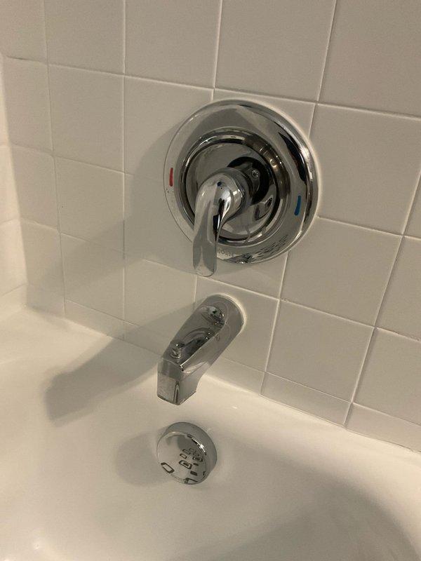 Completed comprehensive whole-home plumbing assessment identifying multiple areas requiring attention. Inspected basement mechanical systems including copper supply lines, PVC drainage piping, pipe insulation, and support brackets mounted to floor joists. Evaluated bathroom plumbing fixtures including tub/shower valve assembly, spout, and overflow components. Documented all findings with photographs for customer review and provided recommendations for necessary repairs and improvements.