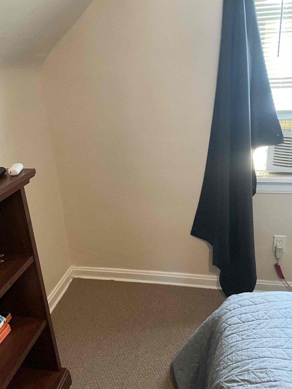 Conducted site assessment for mini split installation in upper-level bedroom with slanted ceiling and evaluated existing electrical panel capacity in basement utility area. Reviewed multiple installation options with homeowner, who requested time to discuss before proceeding with equipment selection and final system configuration.