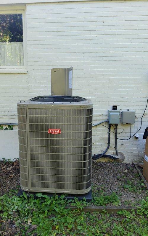 Replaced defective condenser fan motor and blade on Bryant outdoor unit under parts warranty coverage. Installed new Genteq ECM motor (1/4 HP, 230V) with proper wiring connections and verified operational performance during tune-up service completed at customer's requested time.