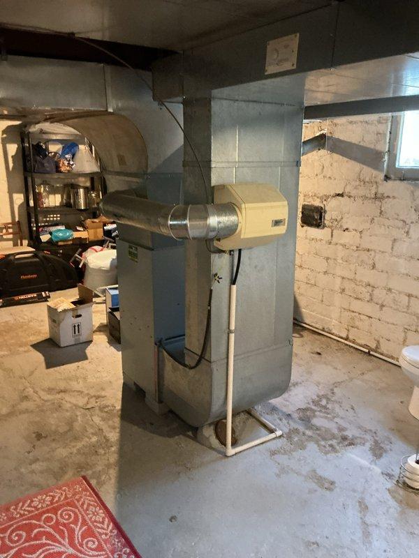 Conducted on-site evaluation for complete HVAC system replacement including existing furnace and add-on air conditioning installation. Assessed current heating equipment located in basement mechanical room and evaluated exterior placement options for new condensing unit on side yard platform area with existing electrical service access. Provided comprehensive estimate for furnace replacement and new AC system integration with existing ductwork infrastructure.
