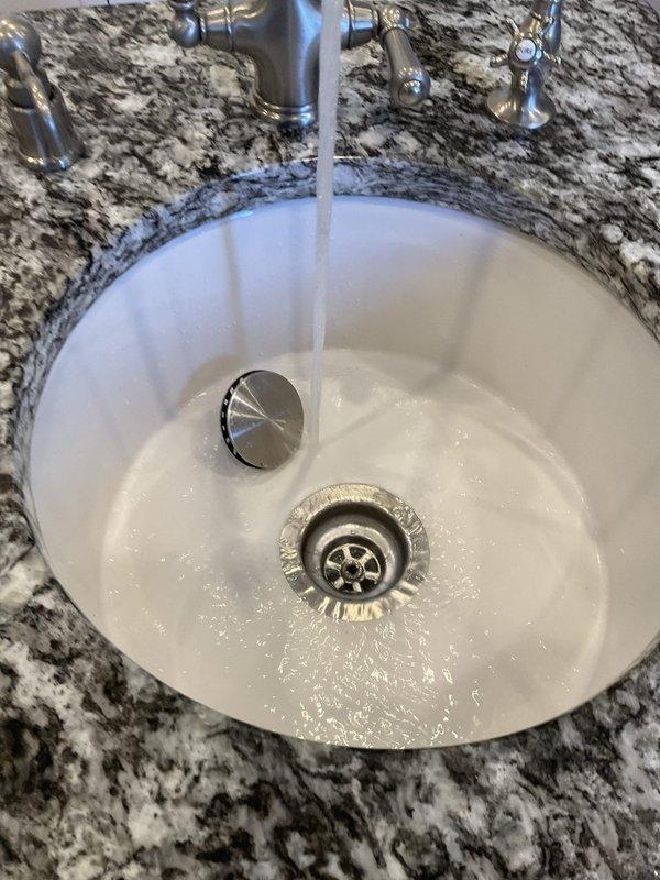 Performed routine descaling maintenance on a tankless water heater unit over 10 years old as part of a recurring home plan service. Connected descaling pump with circulation hoses to flush the heat exchanger using appropriate descaling solution to remove mineral buildup and maintain optimal unit performance. Verified proper hot water flow and temperature at fixtures upon completion of the flush procedure.