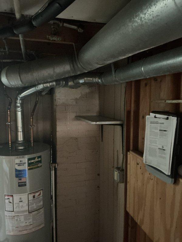 Conducted on-site assessment for HVAC system replacement in residential basement installation. Evaluated existing furnace unit with heat exchanger and connected ductwork, documented current system configuration including flexible metallic ductwork routing and utility room layout with water heater proximity. Confirmed customer availability and provided comprehensive replacement estimate for new equipment installation.