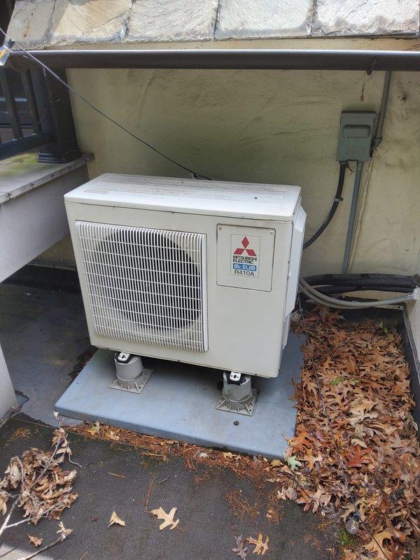 Responded to service call for 15-year-old Mitsubishi multi-zone mini-split system with multiple indoor units not cooling properly. Upon arrival, performed comprehensive system diagnostic including refrigerant pressure testing, electrical component inspection, and airflow assessment of both outdoor condensing unit and indoor air handlers. Noted significant leaf debris accumulation around outdoor unit affecting airflow and heat exchange efficiency. Cleared all debris from condensing unit perimeter and coil surfaces, inspected refrigerant lines for leaks, and tested system operation. Checked refrigerant charge levels and confirmed system had lost refrigerant since previous service. Located and repaired refrigerant leak, evacuated system, and recharged to manufacturer specifications. Verified proper operation of all indoor zones, confirmed adequate cooling output, and tested thermostat functionality. System restored to full operational capacity with all units now providing proper cooling p