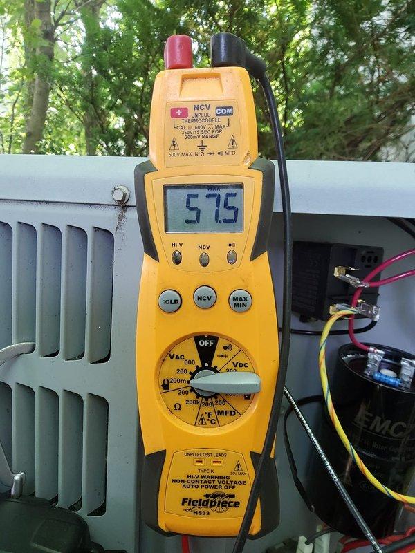 # HVAC Tune-Up Service Completed

Performed comprehensive preventive maintenance tune-up on 12-year-old residential air conditioning system. Conducted complete electrical diagnostics using digital multimeter, verifying supply voltage at 575V and checking capacitor functionality with proper wire connections intact. Utilized Testo 550 digital manifold gauge set to measure and record system pressures and refrigerant charge levels, confirming proper operating parameters. Inspected condenser coil condition and verified all components operating within manufacturer specifications. Customer approved service visit and elected to renew maintenance contract for continued system coverage.