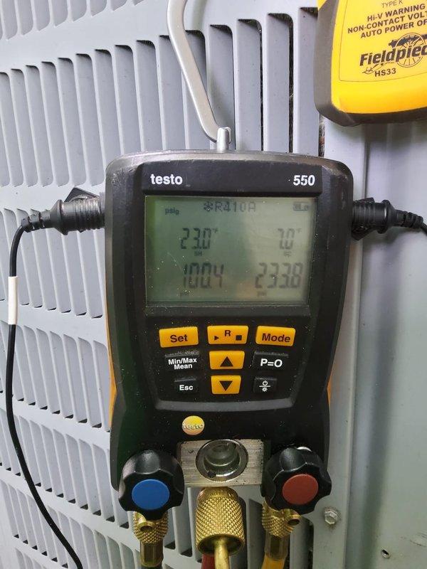# HVAC Tune-Up Service Completed

Performed comprehensive preventive maintenance tune-up on 12-year-old residential air conditioning system. Conducted complete electrical diagnostics using digital multimeter, verifying supply voltage at 575V and checking capacitor functionality with proper wire connections intact. Utilized Testo 550 digital manifold gauge set to measure and record system pressures and refrigerant charge levels, confirming proper operating parameters. Inspected condenser coil condition and verified all components operating within manufacturer specifications. Customer approved service visit and elected to renew maintenance contract for continued system coverage.