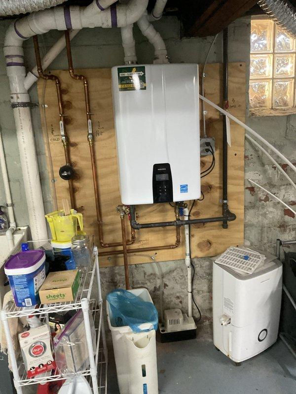 Responded to service call for tankless water heater displaying error code in century-old residential property. Upon arrival, performed diagnostic assessment of unit previously installed by our company. Inspected digital control panel, verified error code, and examined all copper pipe connections and shut-off valves for proper operation. Cleared debris from water inlet strainer which had accumulated sediment and organic material causing flow restriction and triggering fault condition. Tested all plumbing connections, confirmed proper gas supply and venting, and verified Energy Star certified unit returned to normal operating parameters. Reset system, monitored through complete heating cycle, and ensured hot water delivery restored to all fixtures. Unit now functioning properly with no error codes displayed.