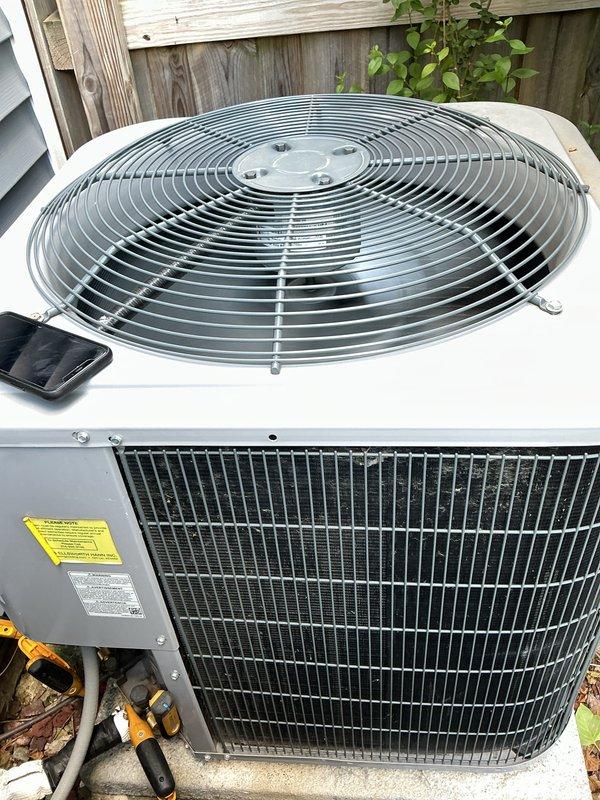 Completed routine air conditioner maintenance on a six-year-old residential cooling system. Performed comprehensive AC tune-up including inspection of outdoor condenser unit, verification of fan operation, examination of condenser coils, and review of manufacturer specifications. System found to be operating properly with no deficiencies noted; unit maintained in good working condition.