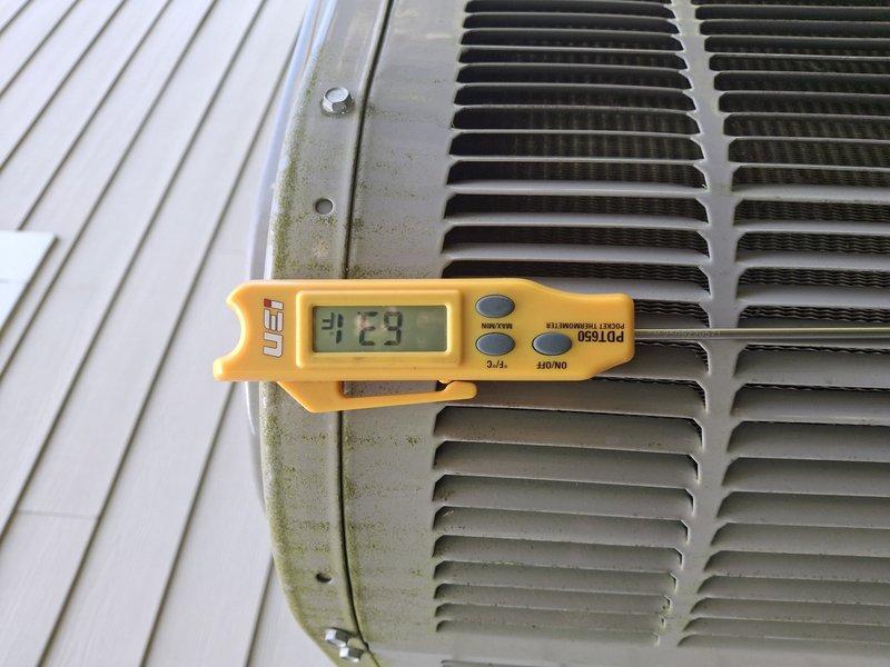 Completed comprehensive preventive maintenance on 3-year-old air conditioning system. Performed standard tune-up procedures including inspection of evaporator coil fins and refrigerant lines, which showed normal condition with proper structural integrity. Measured and documented system temperatures at outdoor condenser unit, recording operational readings to verify proper heat exchange performance. Unit exhibited minor exterior weathering and algae growth on cabinet panels consistent with age, but all critical components functioning within normal parameters.