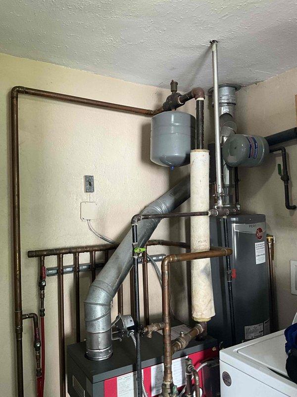 Responded to service call for older Crown boiler with active leak. Applied boiler sealer to address dripping issue as temporary measure. Assessed existing boiler system including copper piping network, expansion tank, and venting configuration. Provided replacement estimate options including standard boiler replacement and combination boiler upgrade alternatives for customer consideration.