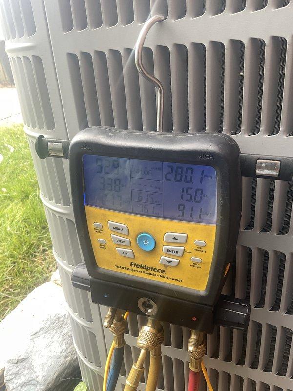 Performed comprehensive air conditioning tune-up on 3-year-old Bryant system. System evaluated and found operating properly with no issues reported by customer. Conducted standard maintenance procedures including refrigerant pressure checks using digital manifold gauges, which confirmed proper system charge and operating parameters within manufacturer specifications. Inspected outdoor condenser unit, verified clean coil fins and proper airflow. Examined indoor furnace and air handler components in basement mechanical room, checked all electrical connections, and verified proper drainage through PVC condensate lines. All system components functioning as designed with no repairs required.