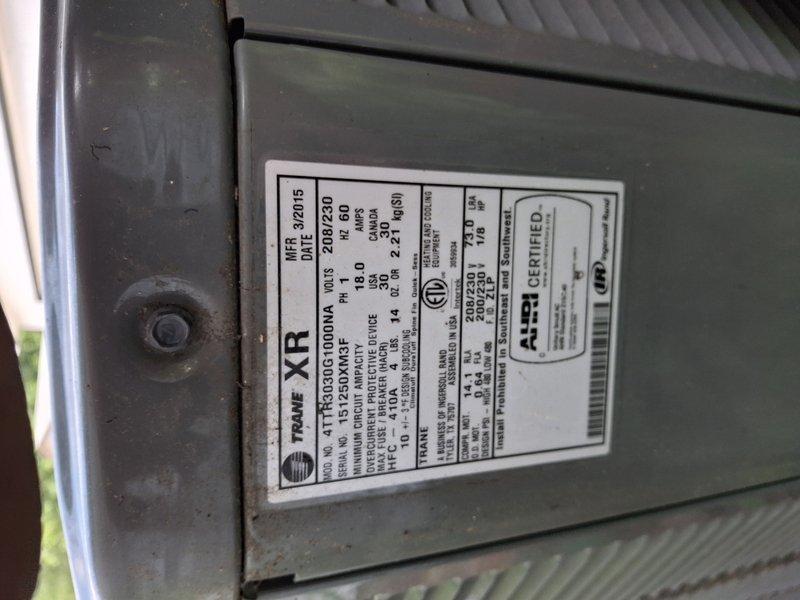 Completed scheduled cooling system maintenance on an 11-year-old Trane XR air conditioning unit manufactured in March 2015. Performed comprehensive tune-up inspection including examination of exterior ventilation components, condenser unit housing, and manufacturer specifications verification. Unit showed normal wear patterns consistent with age and outdoor exposure, with accumulated dust and dirt on louvers and exterior surfaces noted during inspection.