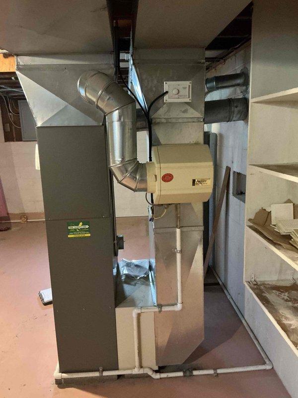 Conducted on-site evaluation for complete HVAC system replacement in residential basement mechanical room. Assessed existing furnace and air handler configuration, documented current installation including ductwork connections, refrigerant lines, and electrical routing for replacement planning. Photographed equipment layout, clearances, and existing infrastructure to develop comprehensive replacement estimate.