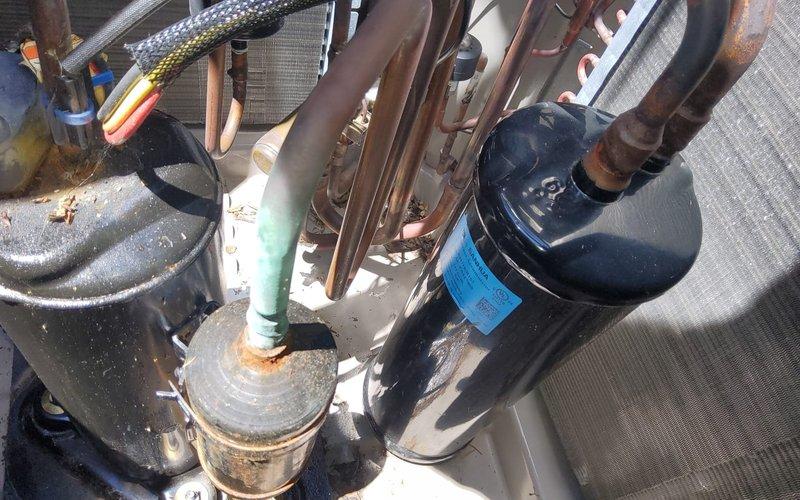 Performed refrigerant recovery service on Bryant heat pump system due to low charge condition. Recovered existing R-410A refrigerant, evacuated system to proper vacuum specifications, and recharged unit with factory specification of 14 lbs of R-410A refrigerant. Applied leak sealant with UV dye to address refrigerant loss issue, with customer understanding that additional refrigerant may be required based on operational pressures and that leak sealant application does not guarantee leak resolution or include comprehensive leak detection service.