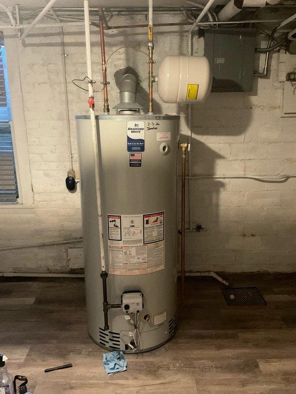 Responded to emergency call for gas leak detected by gas company near recently installed Bradford White water heater. Upon arrival, gas supply was already shut off for safety. Conducted thorough pressure test on all gas lines and connections associated with the water heater installation. Inspected copper piping, brass fittings, and compression connections at top of unit for leaks using soap bubble solution and pressure testing equipment. Verified all connections at the gas control valve and burner assembly. Identified and repaired faulty connection point causing gas leak. Re-tested entire system to confirm leak was eliminated and all connections achieved proper seal. Restored gas supply and verified water heater ignition and proper operation. System tested and confirmed safe for continued use.