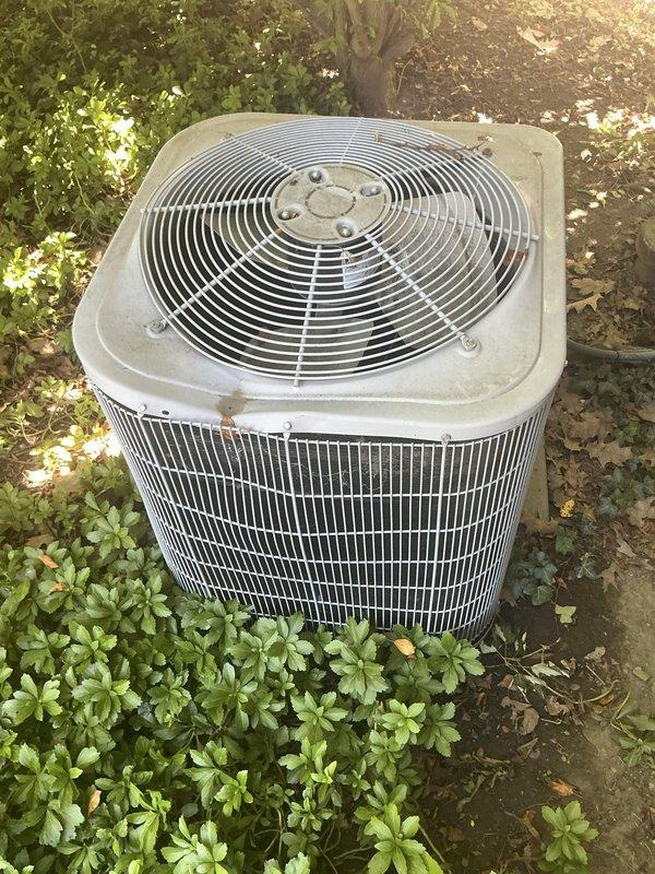 Responded to service call for 5-year-old air conditioning unit rendered inoperable after impact damage from falling ice caused severe denting to top panel and housing, preventing fan blade rotation. Performed on-site assessment and documented extensive physical damage to condenser unit exterior casing and fan assembly. Confirmed insurance company approved repair authorization and captured photographic documentation of damage for claim processing and repair planning purposes.