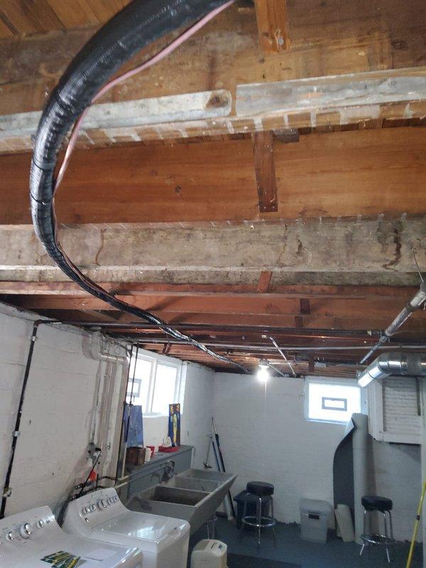 Completed full air conditioning system installation in residential property. Installed new outdoor condensing unit on concrete pad with new electrical disconnect box. Ran new copper refrigerant line set from outdoor unit to indoor air handler, properly insulated and secured. Mounted new Ecobee smart thermostat with remote sensor for zone temperature monitoring and programmed system settings. Installed condensate pump with PVC drainage piping to handle air handler condensate removal. Made all electrical connections, evacuated and charged refrigerant system to manufacturer specifications, and verified proper system operation including airflow, temperature differential, and thermostat communication.