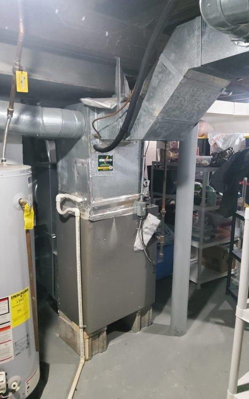 Completed preventive maintenance tune-up on residential Amana air conditioning system. Performed comprehensive inspection of outdoor condenser unit and indoor air handler, checked refrigerant levels, cleaned components, tested electrical connections, and verified proper system operation. Noted vegetation overgrowth around outdoor unit and recommended clearance maintenance for optimal airflow and efficiency.