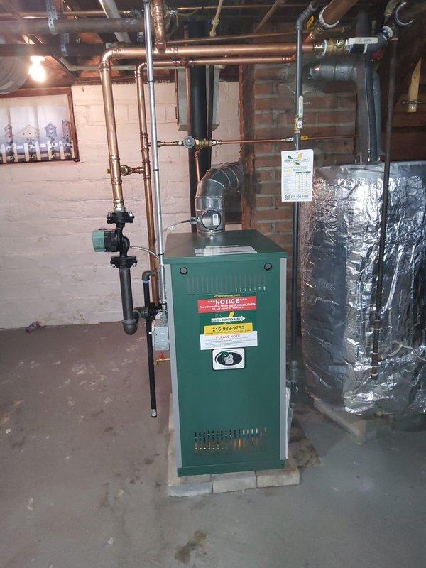 # HVAC Install - Boiler

Successfully installed a Peerless Mi-x-05 hot water boiler system including all required components and near boiler piping modifications. Installed a new pressure reducing valve/backflow preventer combo, expansion tank, circulator pump, and copper shutoff valve on the supply feed. Mounted and programmed a White-Rodgers digital thermostat to control the new heating system, completing a full boiler replacement with all necessary safety and operational components.