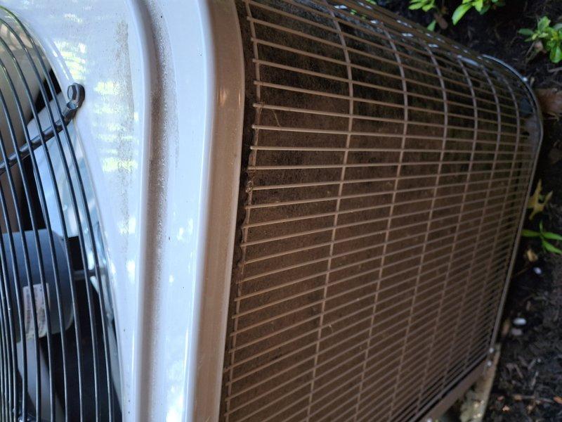 Performed comprehensive AC tune-up on 15-year-old cooling system. Upon arrival, unit was operational with no reported issues or symptoms. Conducted thorough inspection of outdoor condenser unit, which showed significant dirt and debris accumulation on exterior coil grille with visible algae growth and oxidation. Cleaned condenser coils and exterior surfaces to restore proper airflow and system efficiency. Verified fan operation and checked all electrical connections. System tested and confirmed to be functioning properly following maintenance service.