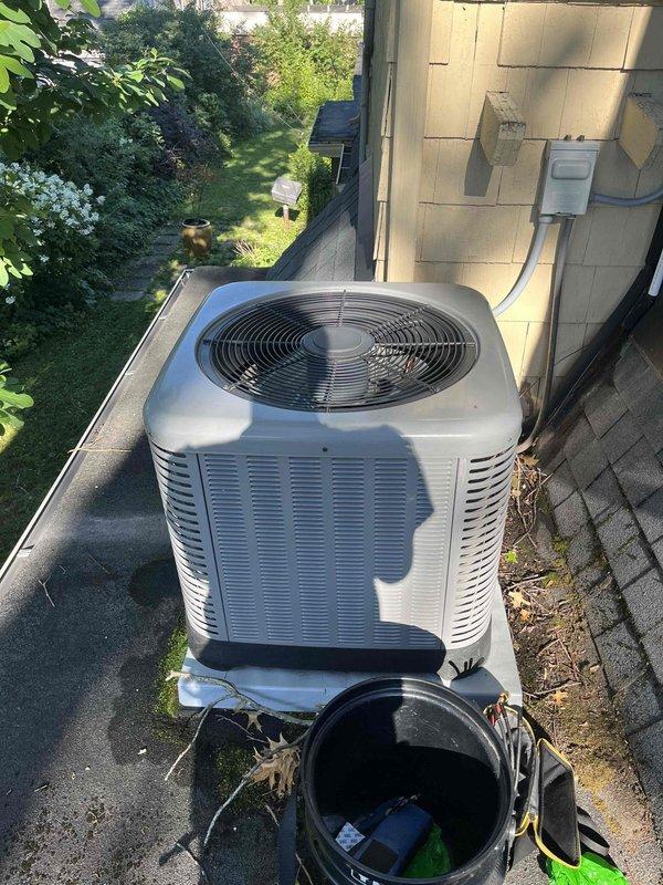 Performed routine maintenance cooling system inspection on a 4-year-old air handler unit. Conducted comprehensive evaluation of indoor air handler components including blower assembly, evaporator coil, and ductwork condition. Inspected outdoor condensing unit mounted on rooftop platform, verifying proper operation of compressor, condenser fan motor, and refrigerant lines. Examined electrical connections at disconnect box and service panel, confirming secure wiring and proper voltage supply. Cleared accumulated debris from around condenser unit base and roof perimeter to ensure adequate airflow and prevent potential drainage issues. System operating within normal parameters with no immediate repairs required at time of service.