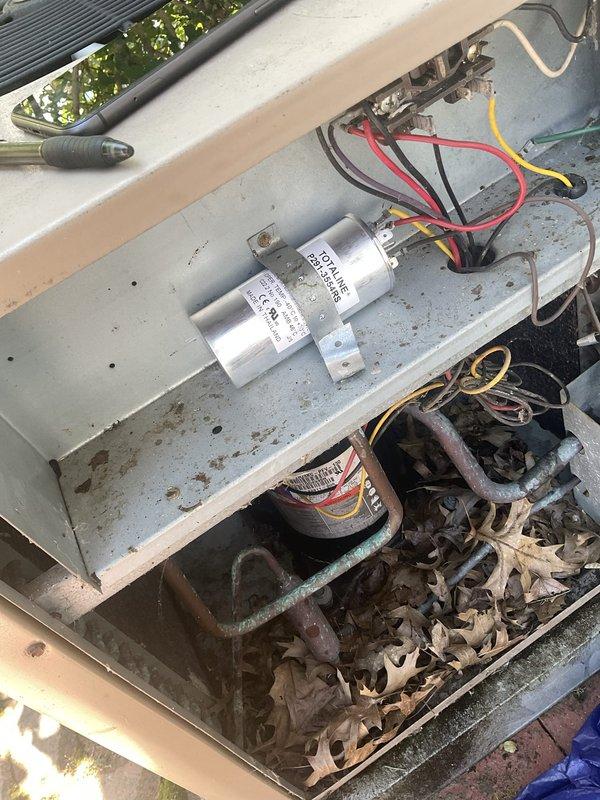 Performed preventive maintenance on a 19-year-old residential air conditioning system. Inspected and tested dual-run capacitor, verified proper voltage readings, and checked electrical connections at the outdoor condensing unit. Cleaned condenser coil, removed debris from unit interior, and confirmed compressor operation within normal parameters.