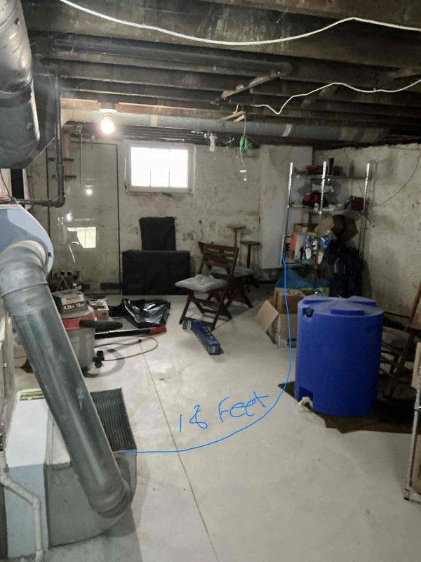 Completed installation of add-on air conditioning system to existing Carrier furnace in basement utility area. Integrated new AC components with existing ductwork infrastructure, installed necessary refrigerant lines, condensate drainage, and electrical connections to provide cooling capability while maintaining existing heating system functionality.
