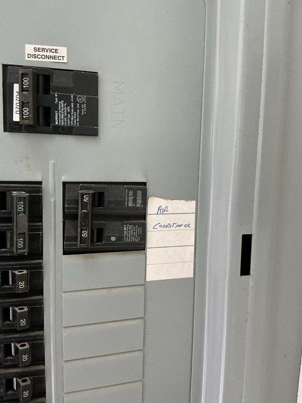Conducted follow-up inspection and documentation of existing electrical service panel in preparation for HVAC system replacement. Photographed current electrical configuration, including main service disconnect, circuit breaker layout, and existing air conditioner circuit identification to assess compatibility and electrical capacity requirements for new equipment installation.