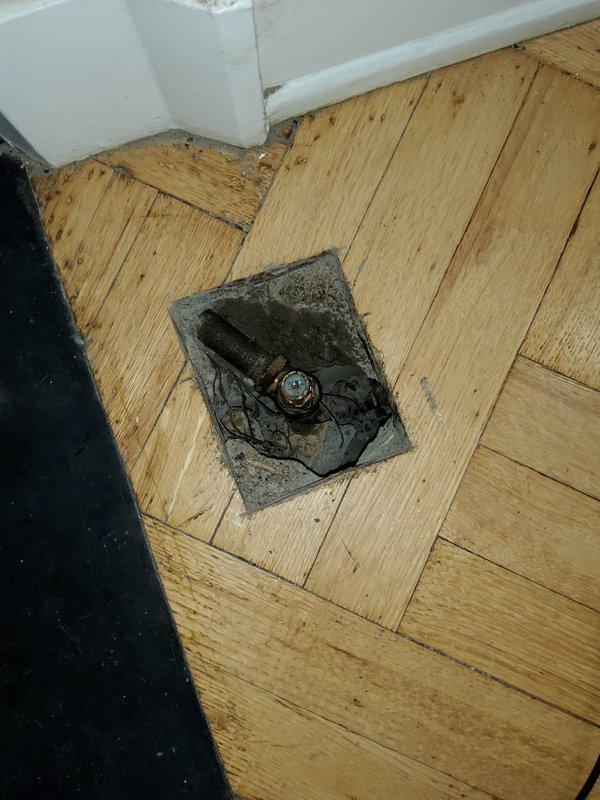 Responded to gas service call where gas supply had been shut off to the unit. Accessed gas line system through floor cutout in living area near fireplace. Installed new gas whip connection under the floor to restore service to stove and fireplace. Repaired damaged gas line section beneath flooring. Completed pressure test on entire gas line system to verify integrity and ensure no leaks present. All connections tested and confirmed operational with gas service safely restored to appliances.
