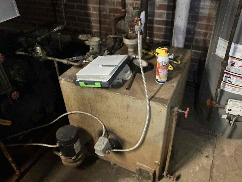 Conducted on-site assessment of existing commercial steam boiler system at church facility to provide replacement estimate. Documented current boiler configuration, including aged piping infrastructure, pump assemblies, control systems, and associated mechanical components showing significant corrosion and deterioration. Evaluated utility room conditions, existing brick structure, concrete flooring, and spatial requirements for new boiler installation and recommended system upgrades to meet current operational needs.