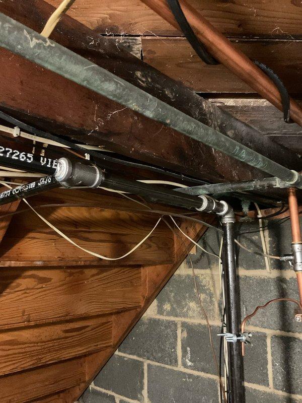 Responded to warranty call for reported gas leak in attic space. Upon arrival, performed comprehensive gas leak detection survey of exposed black iron gas piping system and associated fittings. Inspected all threaded connections, T-joints, and pipe runs utilizing electronic combustible gas detector and soap bubble solution. Identified minor leak at threaded fitting connection near main gas line distribution point. Tightened affected joint to proper torque specification and verified repair with leak detection equipment. Re-tested entire gas piping system throughout accessible areas to ensure no additional leaks present. All connections tested and confirmed secure with no further gas detection readings. System restored to safe operating condition and cleared for continued use.